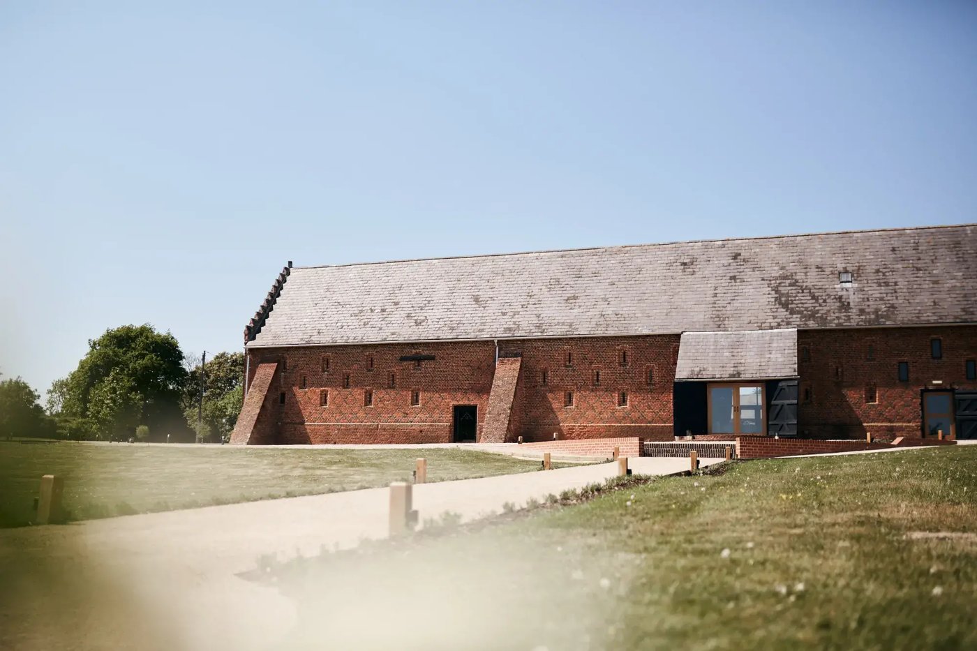 Green outdoor space outside the barn at Copdock Hall
