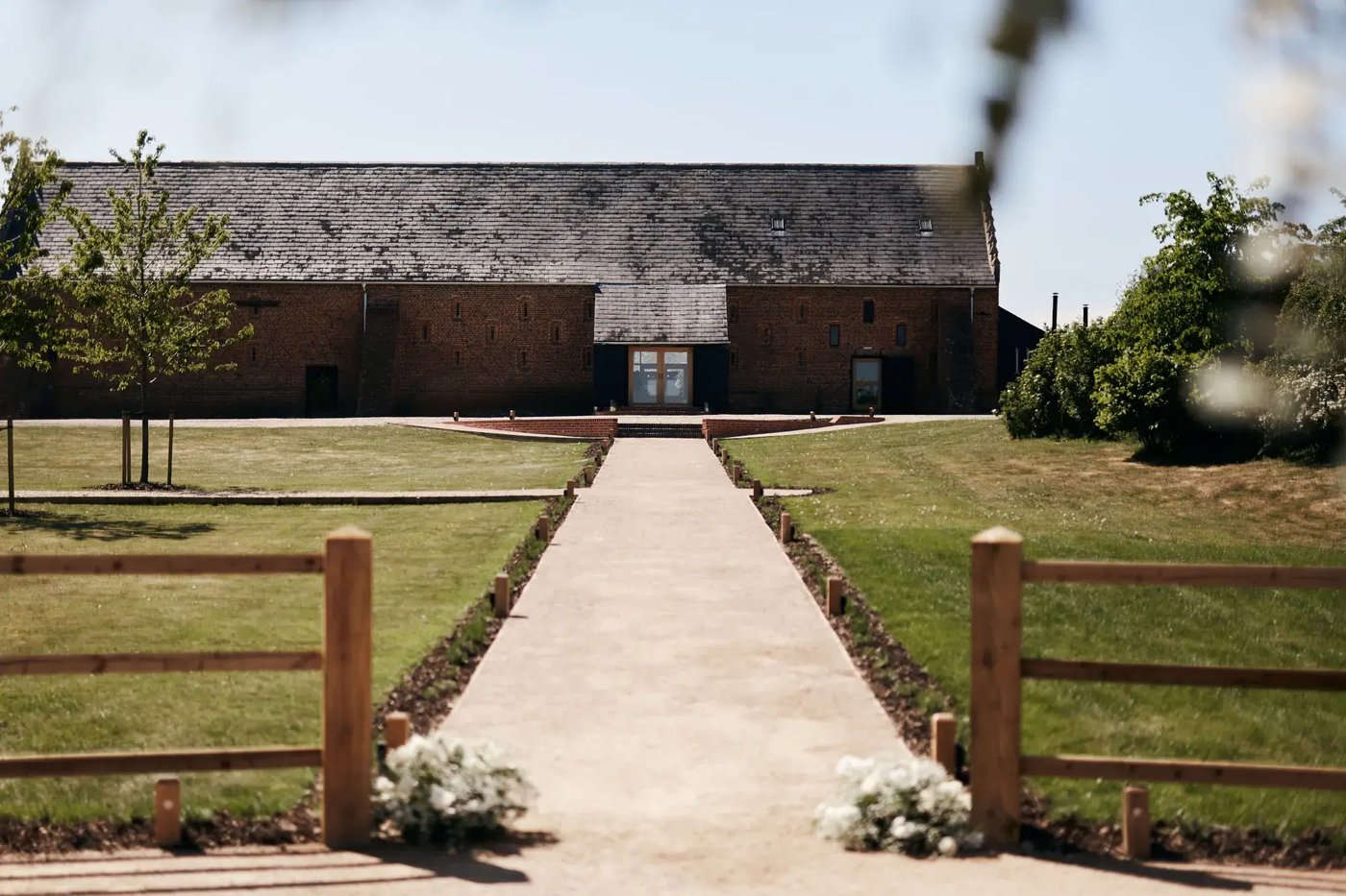 View of the barn from outdoor wedding space at Copdock Hall
