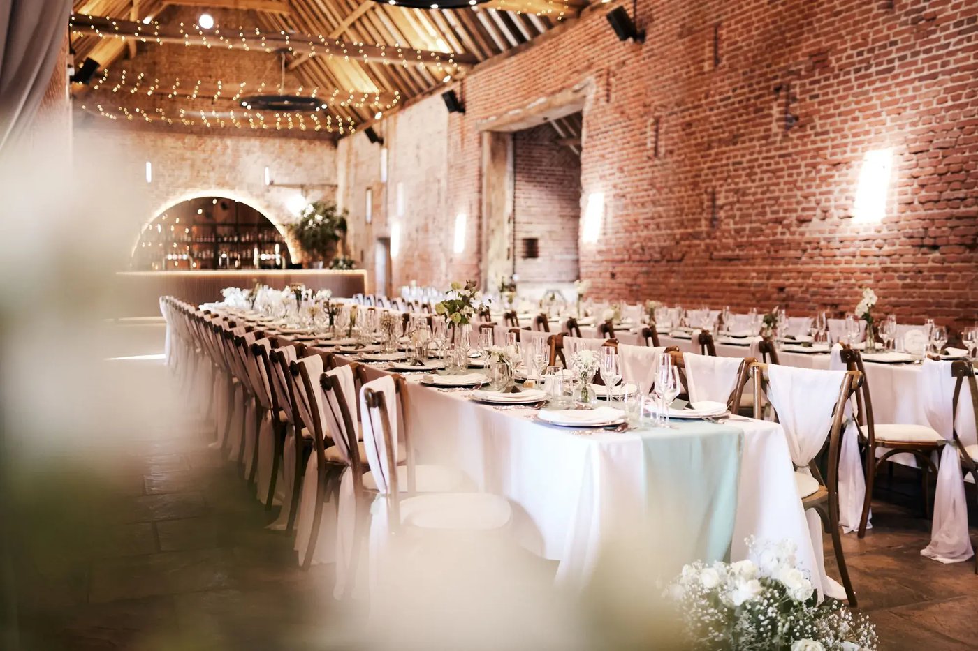 Long tables dressed for a wedding breakfast at Copdock Hall