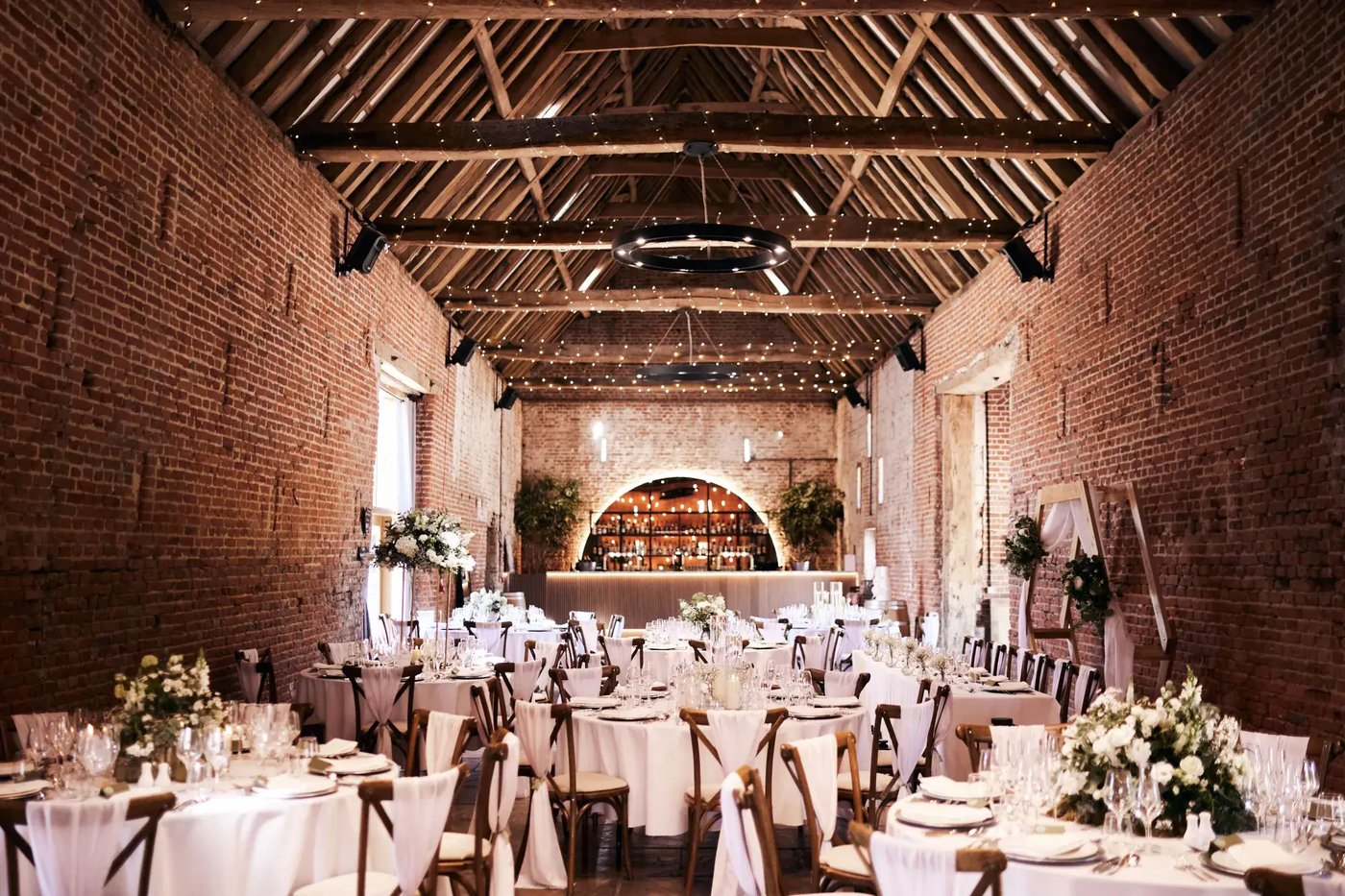 Inside of the barn dressed for a wedding breakfast at Copdock Hall