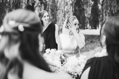 Bride speaking with bridesmaids at Copdock Hall