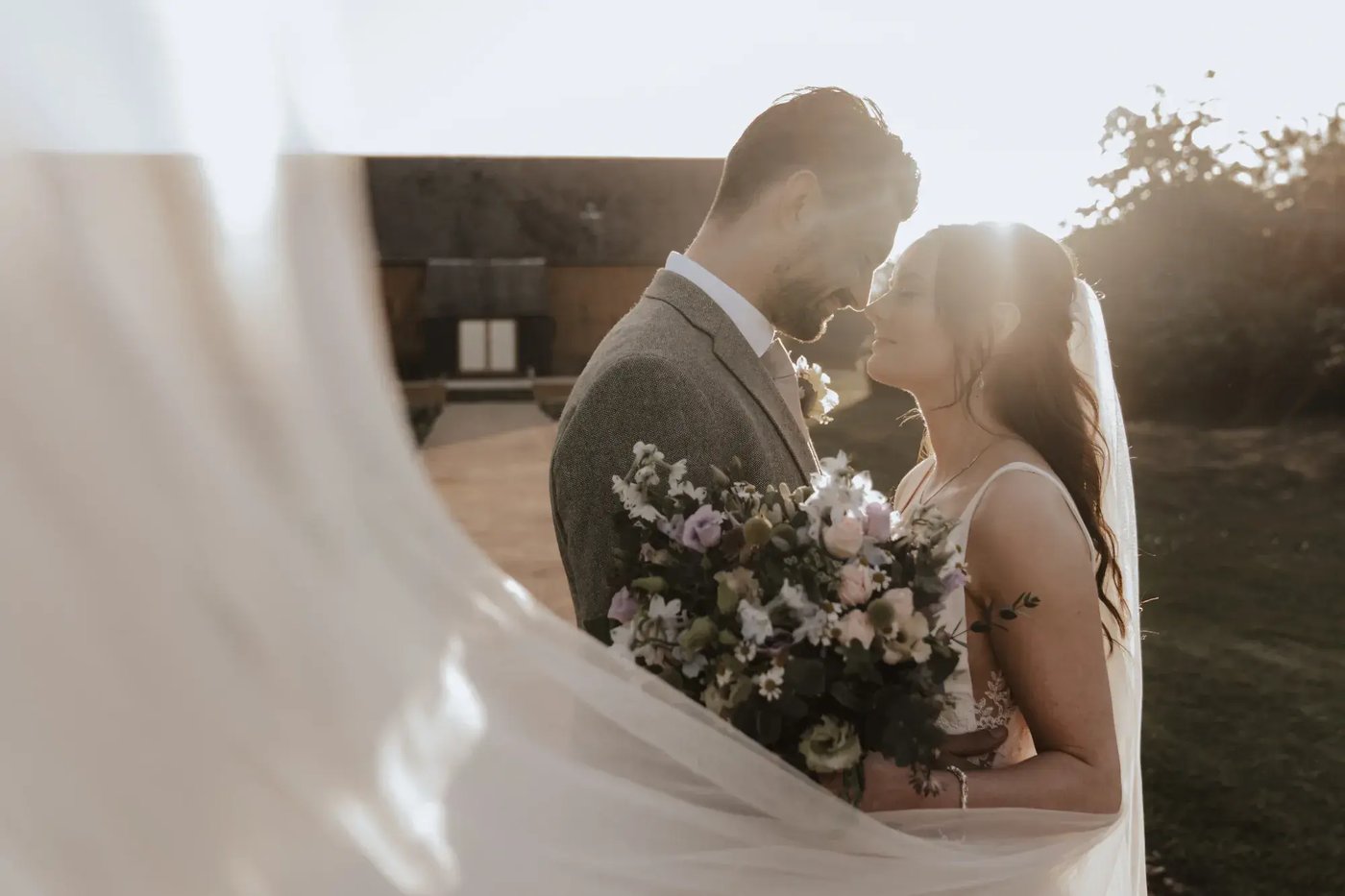 Couple posing with flowers at Copdock Hall