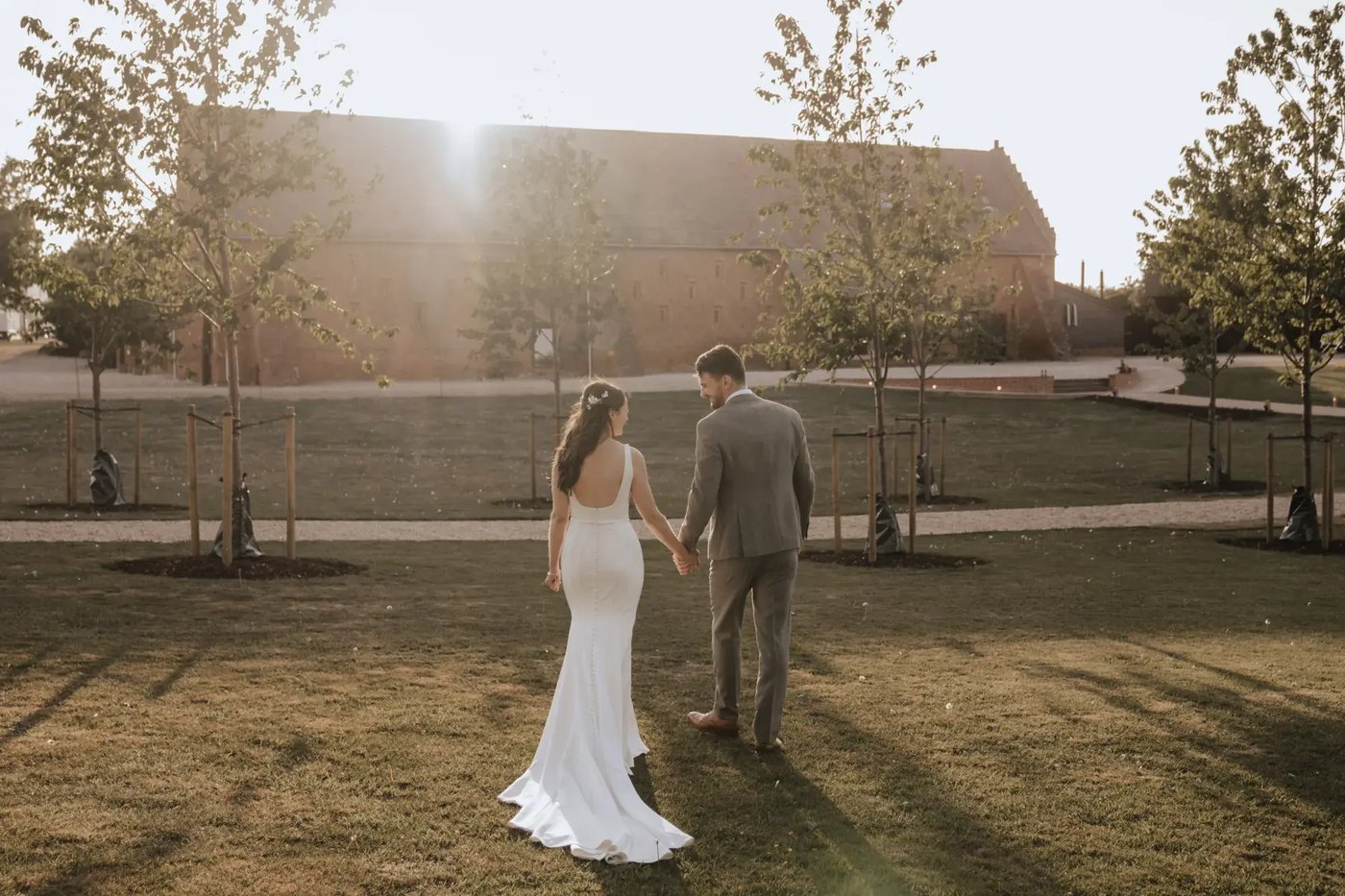 Couple walking towards the venue at Copdock Hall