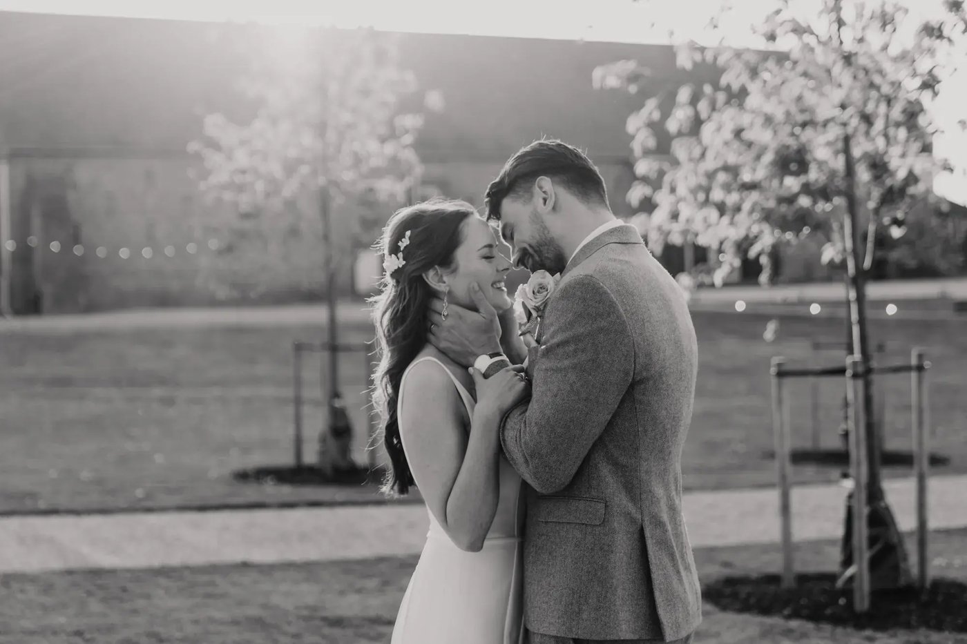 Couple kissing in the grounds at Copdock Hall