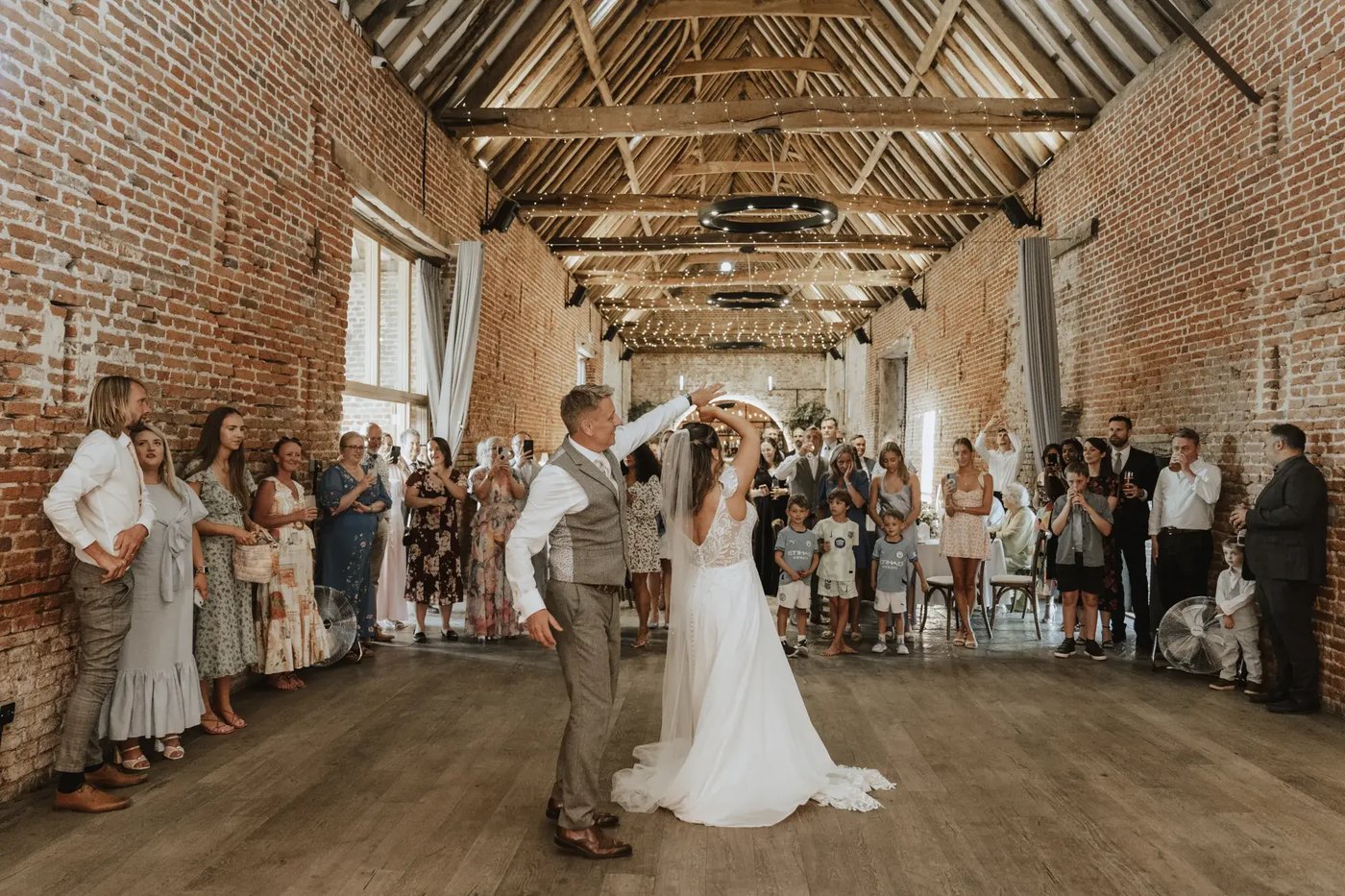 Couple having their first dance in the barn at Copdock Hall