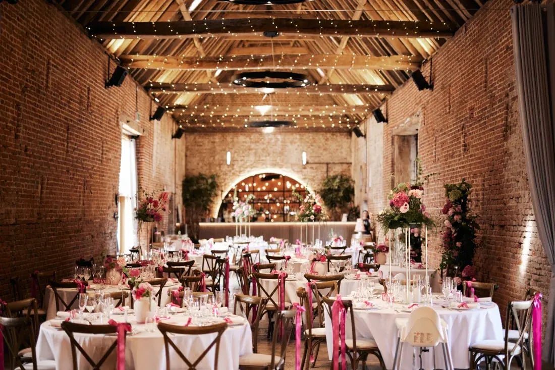 Copdock hall elegant round table set up with bright pink details